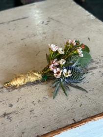 Blue thistle and waxflower buttonhole