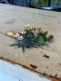 Blue thistle and waxflower buttonhole